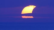 A partial ring of fire solar eclipse arced across the Australia, Indonesia and Hawaii Thursday, blotting out the sun and offering stunning views to skywatchers.